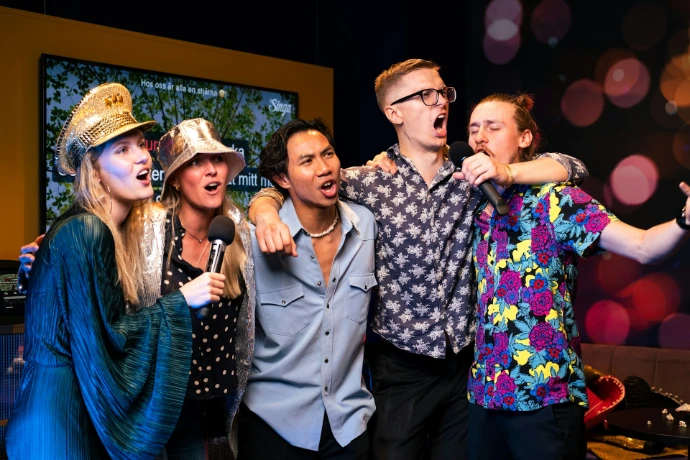 A group of people standing next to each other
